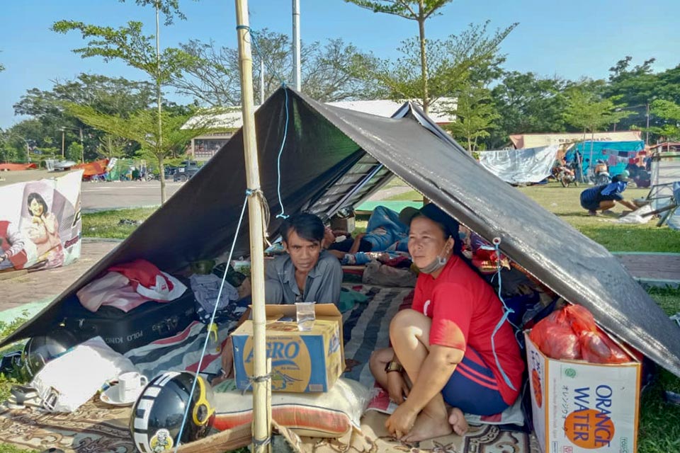 Family in tent, Palu, after Indonesia quake and tsunami