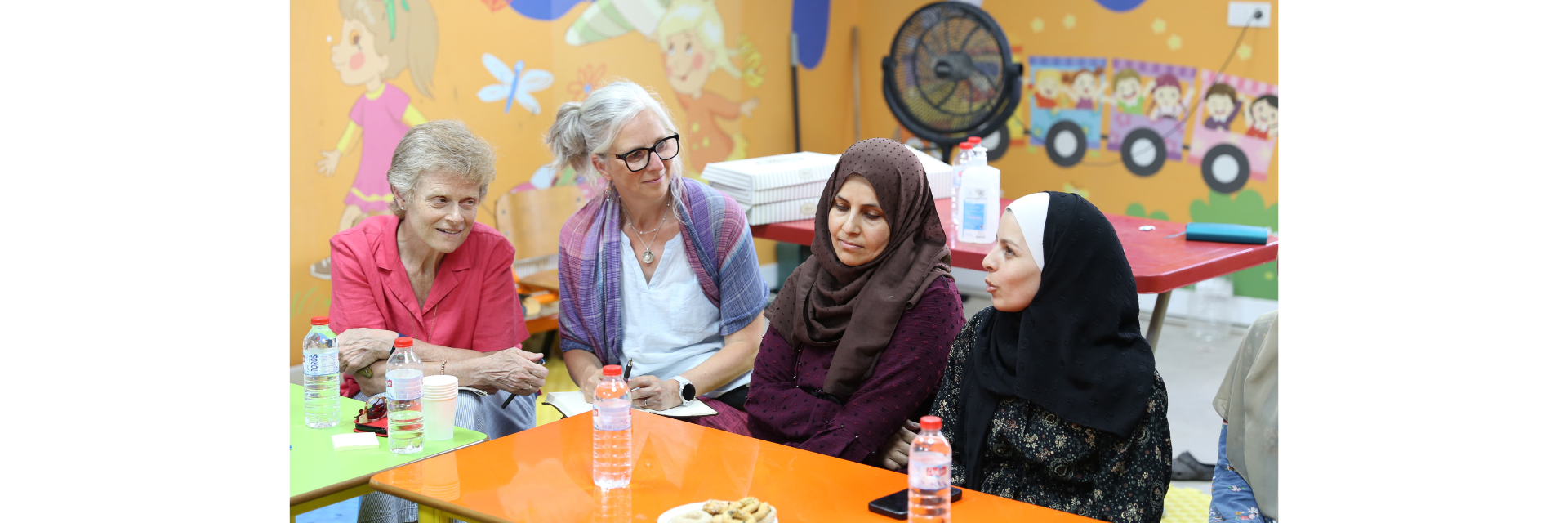 A focus group discussion with Syrian women who live in a refugee camp in Hatay Province, southern Türkiye, who were sharing their experience of the earthquakes and its impact with Bren Melles, Humanitarian Program Specialist, Humanitarian Coalition (second from left), and President and CEO, CARE Canada (far left).