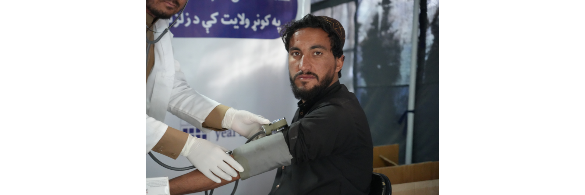 Hafizullah receiving medical attention at a health clinic set up by Islamic Relief Canada.