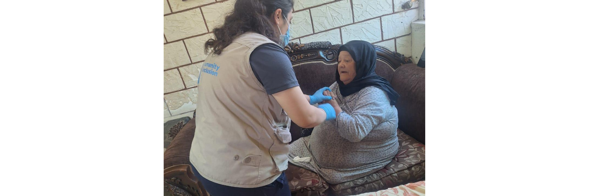 A woman with a lower leg amputation receiving physiotherapy