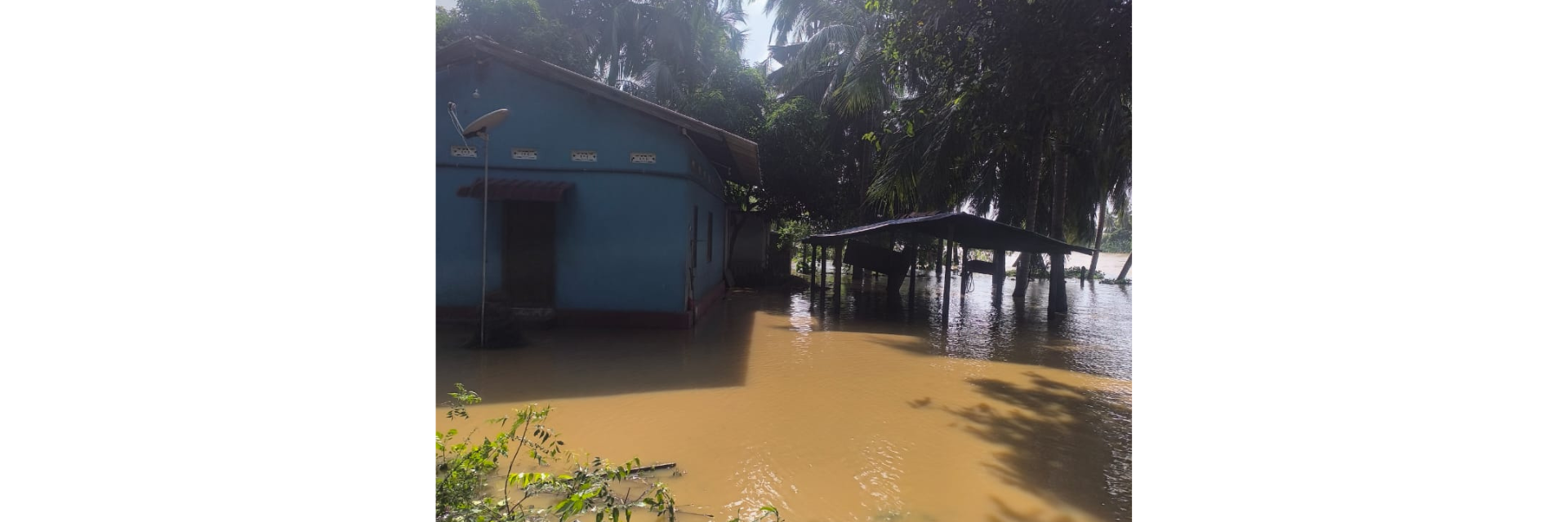 High water levels around a building in a tropical setting
