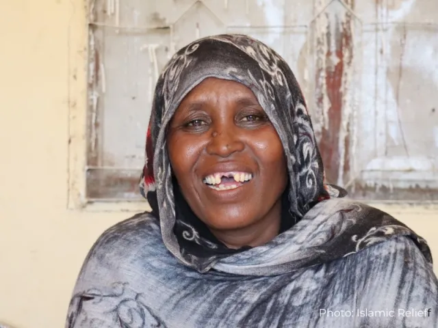 Maryam smiles at the camera