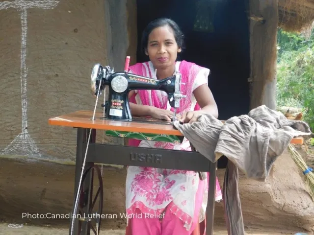 Santoshi sits at her new sewing machine