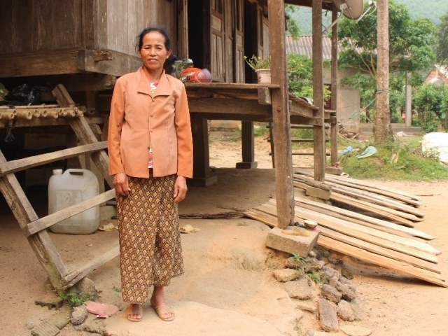 Ho Thi Van in front of her home after the flooding