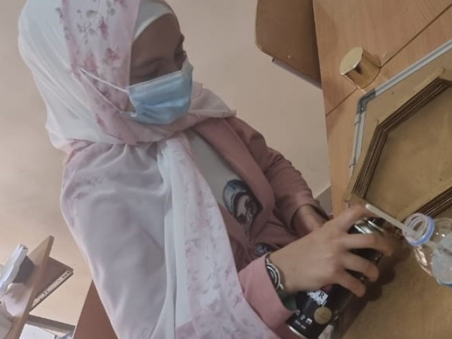 Young girl works on a craft project