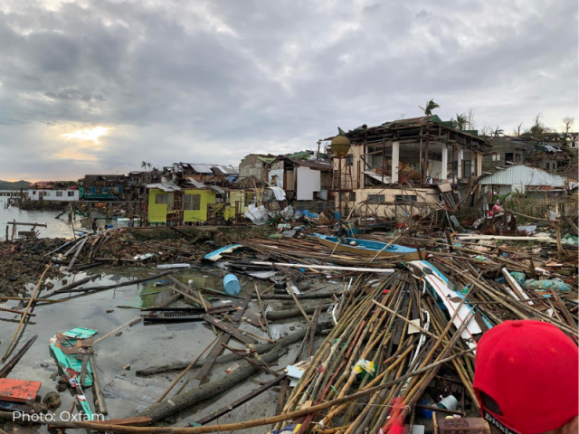 A man surveys the flooding and devastation