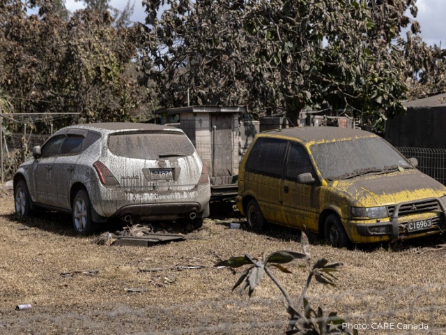 Two cars covered with ash