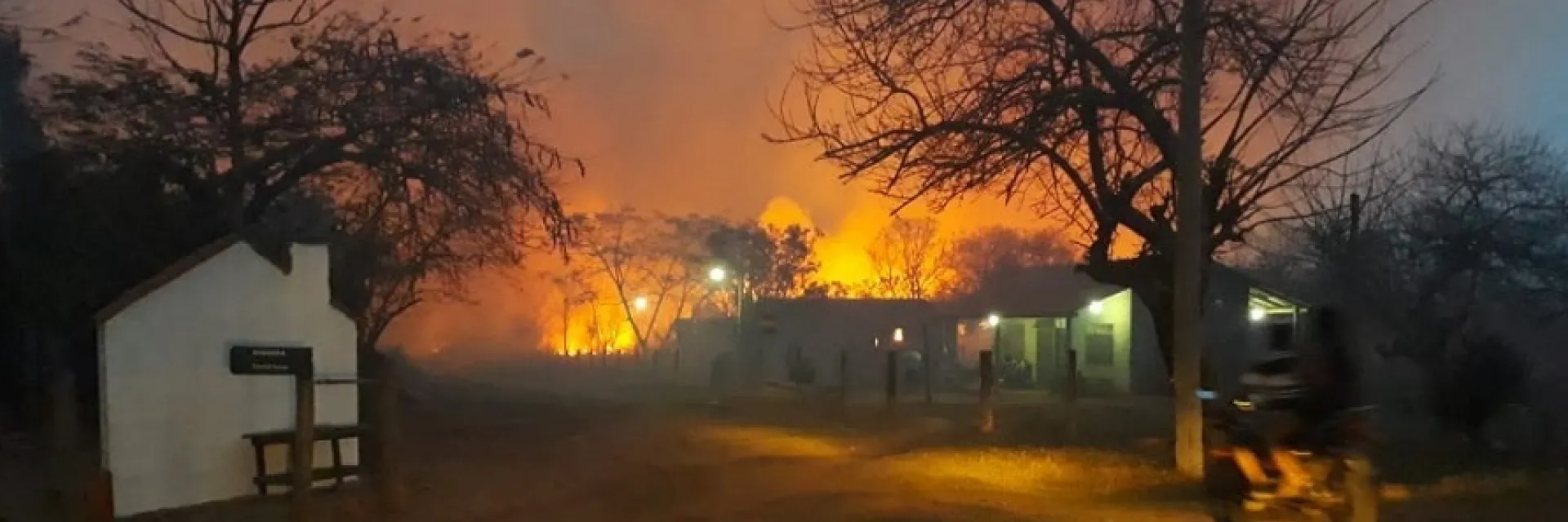 Fires burning behind buildings